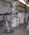 Used Cincinnati Milicron Conical Counter-Rotating Twin Screw Extruder, 55 mm, model E55 Pinnacle. Electrically heated, water cooled vented barrel with pump. Water cooled feed throat with a dosing fee...