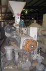 Used Cincinnati Milicron Conical Counter-Rotating Twin Screw Extruder, 55 mm, model E55 Pinnacle. Electrically heated, water cooled vented barrel with pump. Water cooled feed throat with a dosing fee...