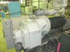 Used Cincinnati Milicron Conical Counter-Rotating Twin Screw Extruder, 55 mm, model E55 Pinnacle. Electrically heated, water cooled vented barrel with pump. Water cooled feed throat with a dosing fee...