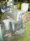 Used Cincinnati Milicron Conical Counter-Rotating Twin Screw Extruder, 55 mm, model E55 Pinnacle. Electrically heated, water cooled vented barrel with pump. Water cooled feed throat with a dosing fee...