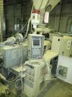 Used Cincinnati Milicron Conical Counter-Rotating Twin Screw Extruder, 55 mm, model E55 Pinnacle. Electrically heated, water cooled vented barrel with pump. Water cooled feed throat with a dosing fee...