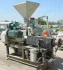 Used 55mm Cincinnati conical, counter rotating twin screw extruder. Has electrically heated, water cooled vented barrel, starve feeder, driven by 40 hp Reliance DC motor with SCR control. Extruder ha...
