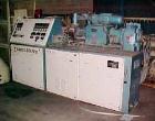 Used Krauss Maffei 50mm Counter-Rotating Twin Screw Extruder, Type KMD-2-50KK. (2) 50 mm diameter screws. Dosing feeder. Gearbox is direct driven by a 30 hp DC motor. Integral panel has 8 zones of di...