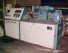 Used Krauss Maffei 50mm Counter-Rotating Twin Screw Extruder, Type KMD-2-50KK. (2) 50 mm diameter screws. Dosing feeder. Gearbox is direct driven by a 30 hp DC motor. Integral panel has 8 zones of di...