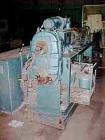 Used Krauss Maffei 50mm Counter-Rotating Twin Screw Extruder, Type KMD-2-50KK. (2) 50 mm diameter screws. Dosing feeder. Gearbox is direct driven by a 30 hp DC motor. Integral panel has 8 zones of di...