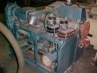 Used Krauss Maffei 40mm Counter-Rotating Twin Screw Extruder, Type KMD2-40KK. (2) 40 mm diameter screws. Gearbox is direct driven by a 25 hp DC motor. Integral panel has 8 zones of RKC digital contro...