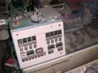 Used Krauss Maffei 40mm Counter-Rotating Twin Screw Extruder, Type KMD2-40KK. (2) 40 mm diameter screws. Gearbox is direct driven by a 25 hp DC motor. Integral panel has 8 zones of RKC digital contro...