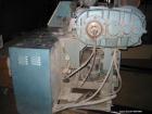Used Krauss Maffei Model KMD2-50KK Counter-Rotating Twin Screw Extruder. 50 mm Diameter screws, 30 hp motor, 6 barrel and 8 die zones, serial #205325, year 1995.