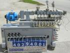 Used Leistritz Counter-Rotating 18 mm Twin Screw Extruder, Model MIC18/GG-40D. 8 Barrel sections, electrically heated, water cooled. Feed section with small hopper. Driven by a 3 hp, 3/60/120 hz, 230...