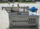 Used Leistritz Counter-Rotating 18 mm Twin Screw Extruder, Model MIC18/GG-40D. 8 Barrel sections, electrically heated, water cooled. Feed section with small hopper. Driven by a 3 hp, 3/60/120 hz, 230...