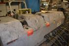 Used Ikegai 65mm Twin Screw Extruder, Model PCM-65II. Liquid heated, and cooled. 8 Zone top vented barrel. Top mounted twin screw feeder. Approximate 64