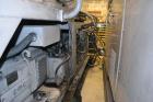 Used Ikegai 65mm Twin Screw Extruder, Model PCM-65II. Liquid heated, and cooled. 8 Zone top vented barrel. Top mounted twin screw feeder. Approximate 64
