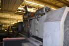 Used Ikegai 65mm Twin Screw Extruder, Model PCM-65II. Liquid heated, and cooled. 8 Zone top vented barrel. Top mounted twin screw feeder. Approximate 64