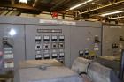 Used Ikegai 65mm Twin Screw Extruder, Model PCM-65II. Liquid heated, and cooled. 8 Zone top vented barrel. Top mounted twin screw feeder. Approximate 64