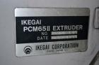 Used Ikegai 65mm Twin Screw Extruder, Model PCM-65II. Liquid heated, and cooled. 8 Zone top vented barrel. Top mounted twin screw feeder. Approximate 64