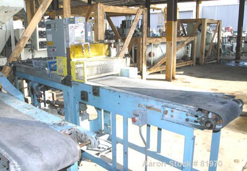 USED: Guillotine cutter. (1) 13" wide blade. Air operated single ram. Mounted on a table with a 12" wide x 10' long rubber b...