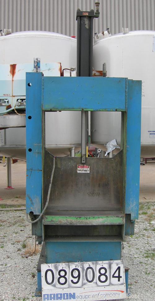 USED: Goodman hydraulic guillotine cutter, model 15. (1) 30" wide blade, single ram. Mounted on a frame with approximate 30" wide x 22" long roller conveyor infeed.Set up for maximum bale size of 30"...