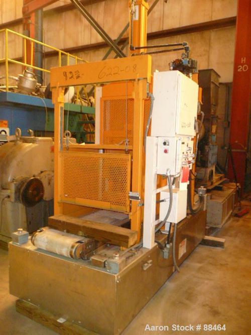 USED: Spadone 27" wide hydraulic guillotine. Approximately 20" stroke and daylight. Includes a hydraulic power pack. Mounted on an 18" high platform.