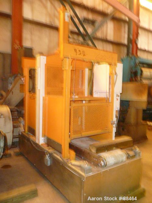 USED: Spadone 27" wide hydraulic guillotine. Approximately 20" stroke and daylight. Includes a hydraulic power pack. Mounted on an 18" high platform.