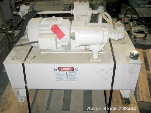 USED: Spadone 27" wide hydraulic guillotine. Approximately 20" stroke and daylight. Includes a hydraulic power pack. Mounted on an 18" high platform.