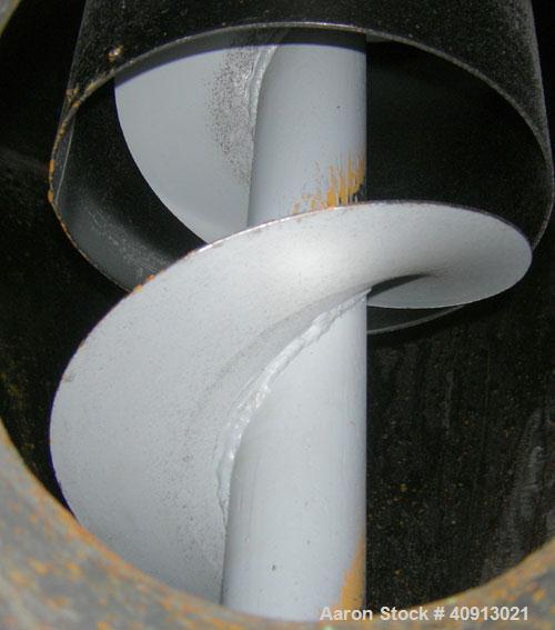 Used Vertical Screw Mixer, Approximate 35 cubic feet capacity, carbon steel. Approximately 44" diameter x 41" straight side x 36" coned bottom. 9" diameter vertical screw, driven by a 5 hp, 3/60/208-...