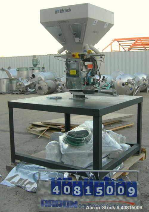 Used AEC Optimum OS Series Gravimetric Batch Blending System, Model OS-007-4, Carbon Steel.  (4) compartments.  Mounted on a carbon steel table.


