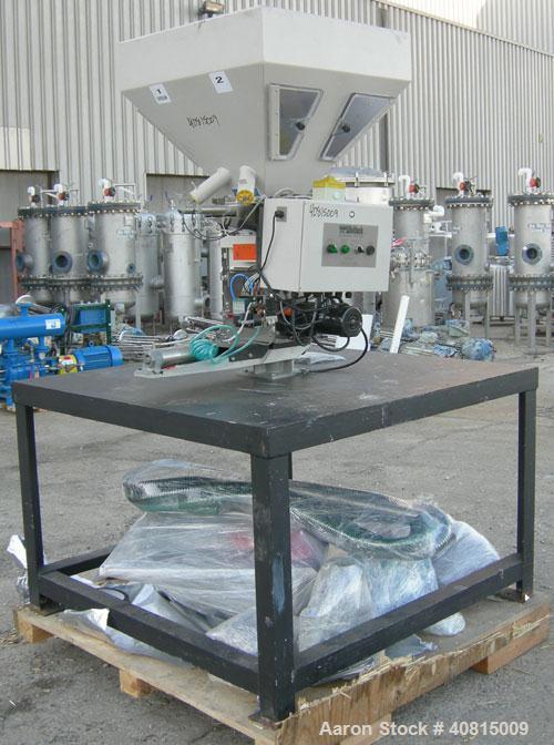 Used AEC Optimum OS Series Gravimetric Batch Blending System, Model OS-007-4, Carbon Steel.  (4) compartments.  Mounted on a carbon steel table.

