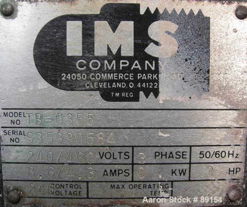 Used IMS Dual Drum Tumbler, Model TB-0355, Carbon Steel. Capacity (2) 55 gallon drums at 280 lbs per drum. Manually adjustable to accomodate 35 gallon drums. Driven by a 3 hp, 3/60/240/460 volt motor.