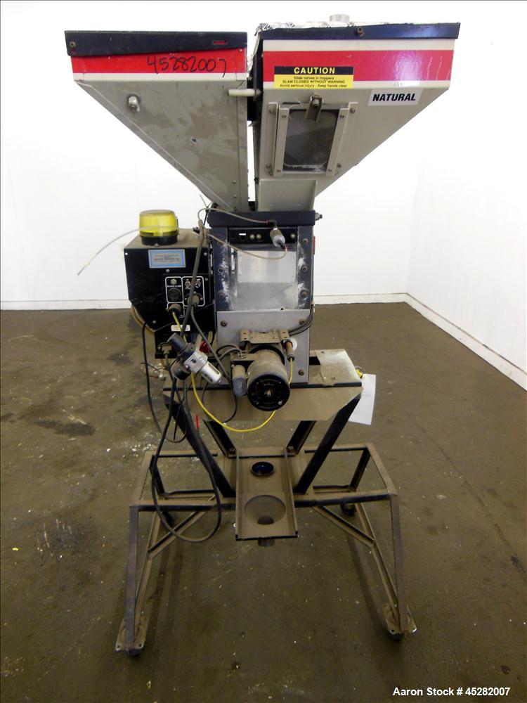 Used McGuire 4 Color Weigh Scale Blender, Model W-140RM1. Mounted on a stand with casters. Serial# 89574.