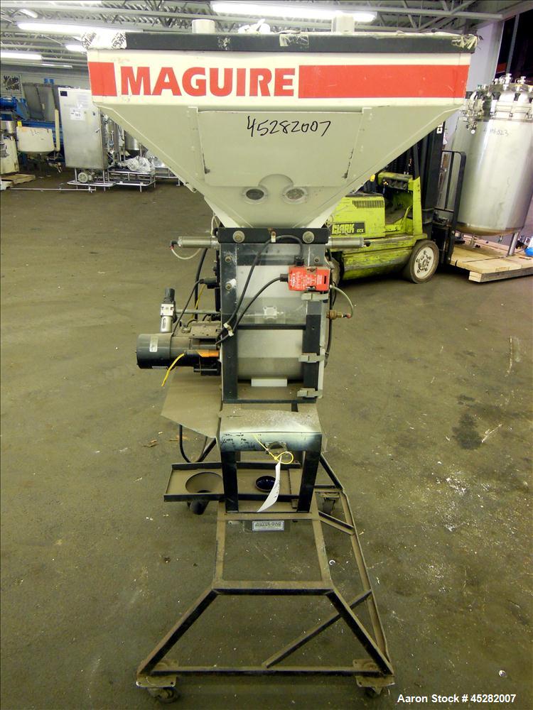 Used McGuire 4 Color Weigh Scale Blender, Model W-140RM1. Mounted on a stand with casters. Serial# 89574.
