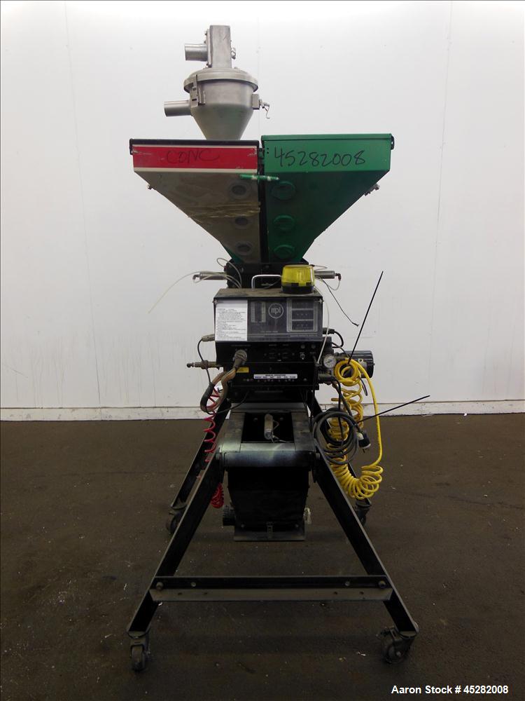 Used McGuire 4 Color Weigh Scale Blender, Model W-140RM1. Mounted on a stand with casters. Serial# 89363.