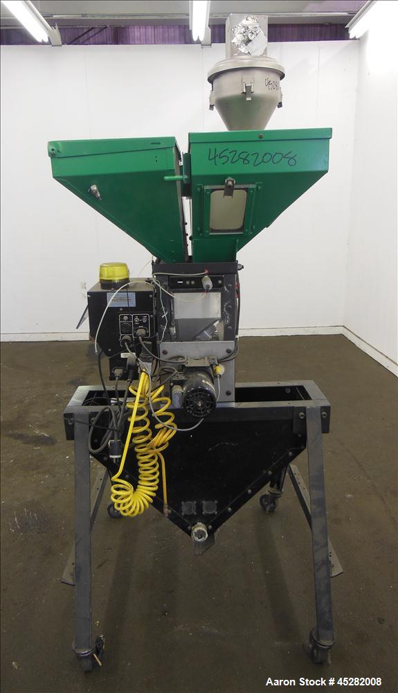 Used McGuire 4 Color Weigh Scale Blender, Model W-140RM1. Mounted on a stand with casters. Serial# 89363.