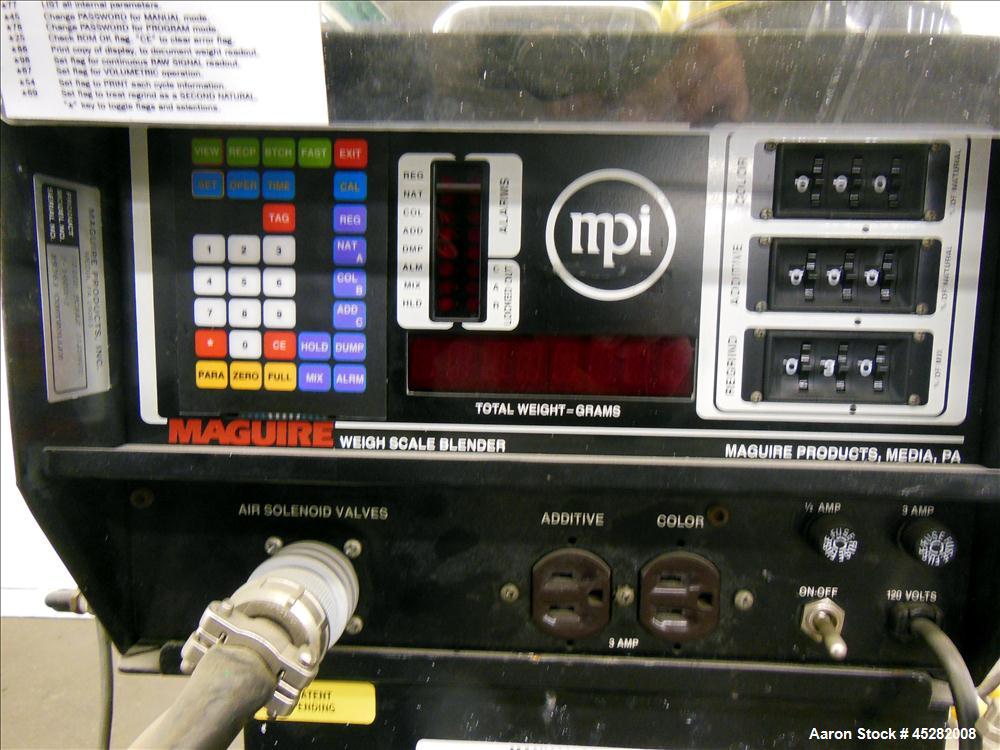 Used McGuire 4 Color Weigh Scale Blender, Model W-140RM1. Mounted on a stand with casters. Serial# 89363.