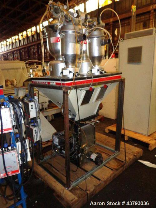Used Maguire 4 material volumetric blender, model WSB 440T, rated up to 1450 lbs/hr, with Mould Tek pneumatic vacuum loaders, 1/6 HP 110 volt mixer motor, serial# 102135.14.
