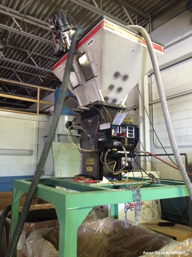 Used Maguire 4 Material Gravimetric Blender, Model WSB 440.  Rated up to 1400 lbs/hr.  4-2" x 3" Slide Gate.