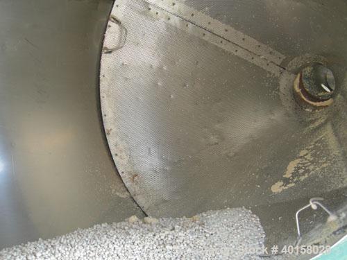 Used Drying Hopper, 304 stainless steel. 28" diameter x 54" straight side x 14" coned bottom. 2 1/2" side opening, approximate 8" center bottom outlet. Mounted on a carbon steel frame.