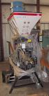Used McGuire Loss And Weight 3 Component Blender. Has (2) primary component hoppers with third component being a color side feeder. Includes operator controls.