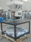 Used AEC Optimum OS Series Gravimetric Batch Blending System, Model OS-007-4, Carbon Steel.  (4) compartments.  Mounted on a carbon steel table.

