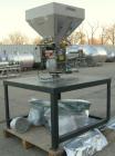 Used AEC Optimum OS Series Gravimetric Batch Blending System, Model OS-007-4, Carbon Steel.  (4) compartments.  Mounted on a carbon steel table.

