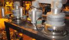 Used AEC Optimum OS Series Gravimetric Batch Blending System, Model OS-007-4, Carbon Steel.  (4) compartments.  Mounted on a carbon steel table.

