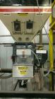 Used Maguire Products Weigh Scale Blender, Model WSB-140R, Carbon Steel. Maximum throughput 330-450 pounds an hour. Number of materials-4. Includes a Gaylord style stand. Built 2001.