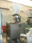 Used Maguire Model WSB240F 4 Component Blender. Up to 900 lbs/hour, 4 slide gates, hopper material level sensors, hopper site glasses, Gaylord gravity discharge into approximate 30 cubic foot materia...