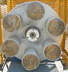 Used Hose Reinforcement Station.  (2) 6 can stations.  Both driven by a 2 hp, 180 volt, 2500 rpm DC motor.  Includes a control panel.  Mounted on a frame.