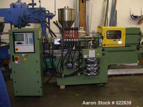 USED: Arburg model 221M-55-250, 28 ton, 1 oz shot capacity. Mfg 1997. Toggle clamp having 7.87" stroke, tie bar spacing 8.7" x 8.7", 13.46" x 9.84" daylight max/min. 7.28 hp. Unit equipped with Multi...