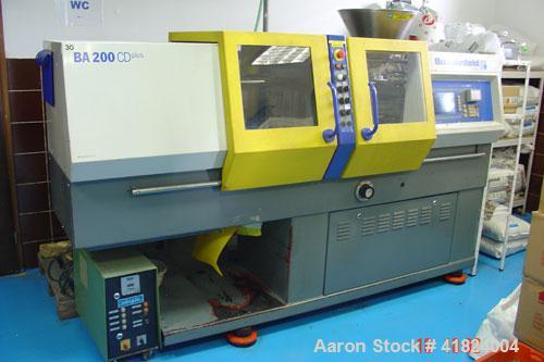 Used Battenfeld BA 200 CD Plus Injection Molding Machine. 20 ton clamping pressure, plate size 10" x 10" (254 x 254 mm), max daylight 13" (325 mm), 0.7 ounce/second (20 gram/second) shots, 7 hp/5.5 k...