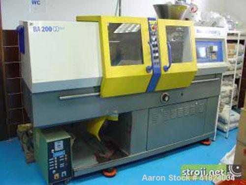 Used Battenfeld BA 200 CD Plus Injection Molding Machine. 20 ton clamping pressure, plate size 10" x 10" (254 x 254 mm), max daylight 13" (325 mm), 0.7 ounce/second (20 gram/second) shots, 7 hp/5.5 k...