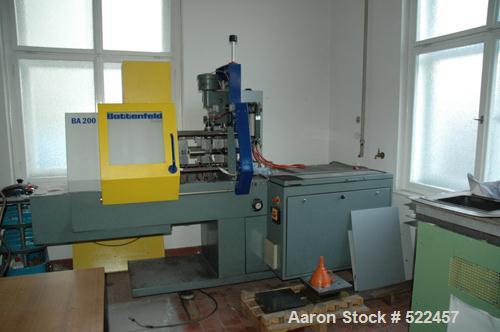 USED: Battenfeld injection compression molding machine, type BA200.Table size 15.6" x 15.6" (400mm x 400mm). Clamping force 20 tons (200Kn). (1) Arburg 0.47" (12mm) diameter plunger. (1) Battenfeld U...