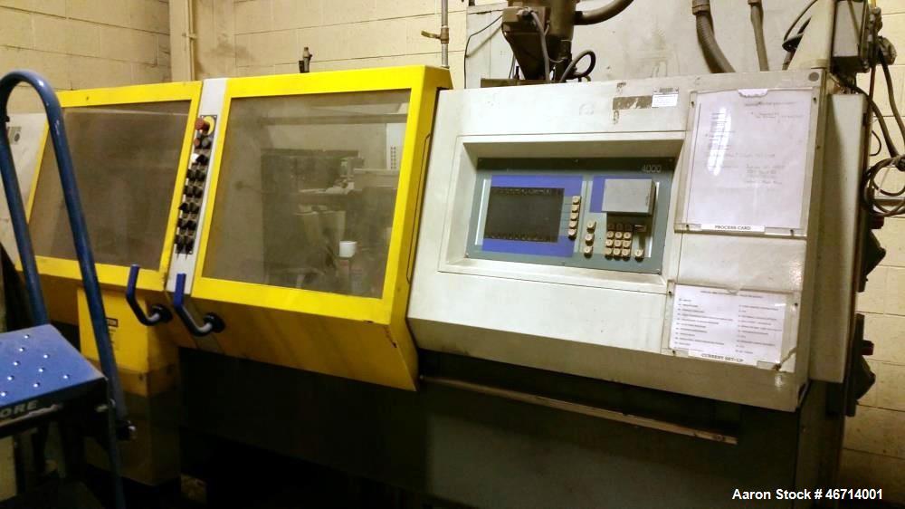 Used Battenfeld Injection Molding Machine, Model BA400/125. With Unilog 4000 controls. Approximately 44 ton and 10 ounce Shot. Size of mould platens (h x v): 440 mm x 440 mm. Distance between tie bar...