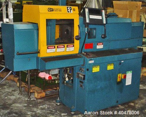 Used Boy horizontal injection molder, 25 ton, model 25M. With Proscan control LCD screen. Includes hopper. Built 1995.