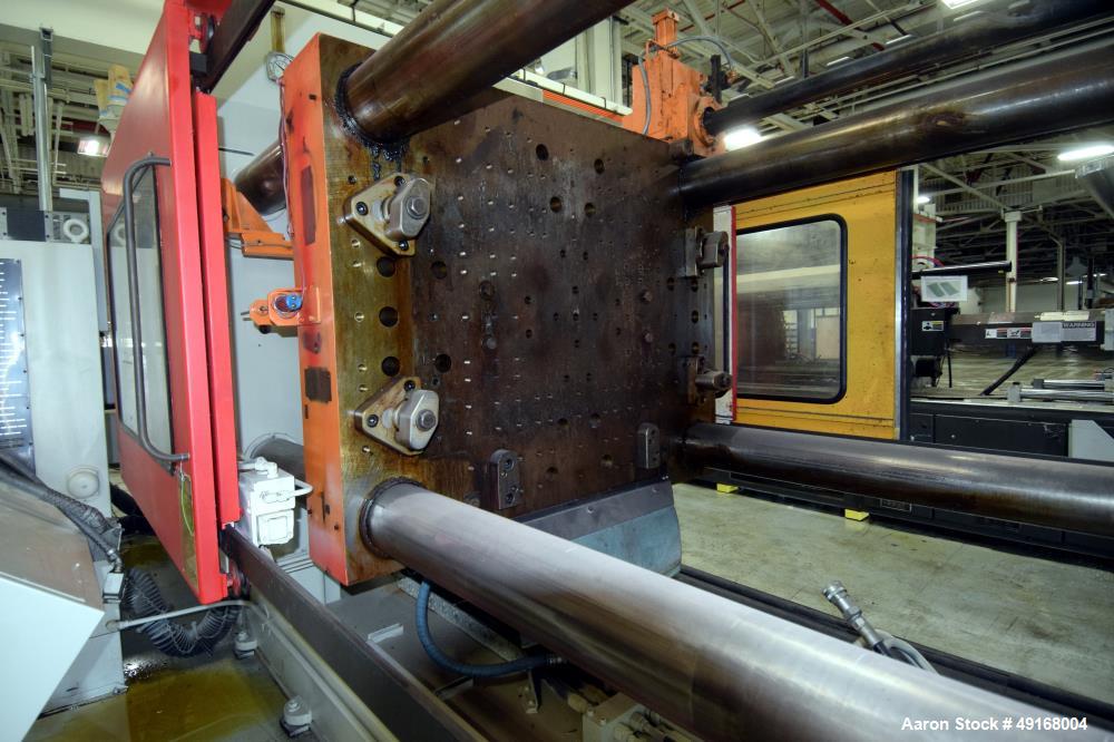 Used Cincinnati Milacron Horizontal Injection Molder, 700 Ton, Model 700-32 W/P. Clamp force approximate 700 tons, approximate maximum daylight 70", approximate platen size 54.5" x 54.5", approximate...